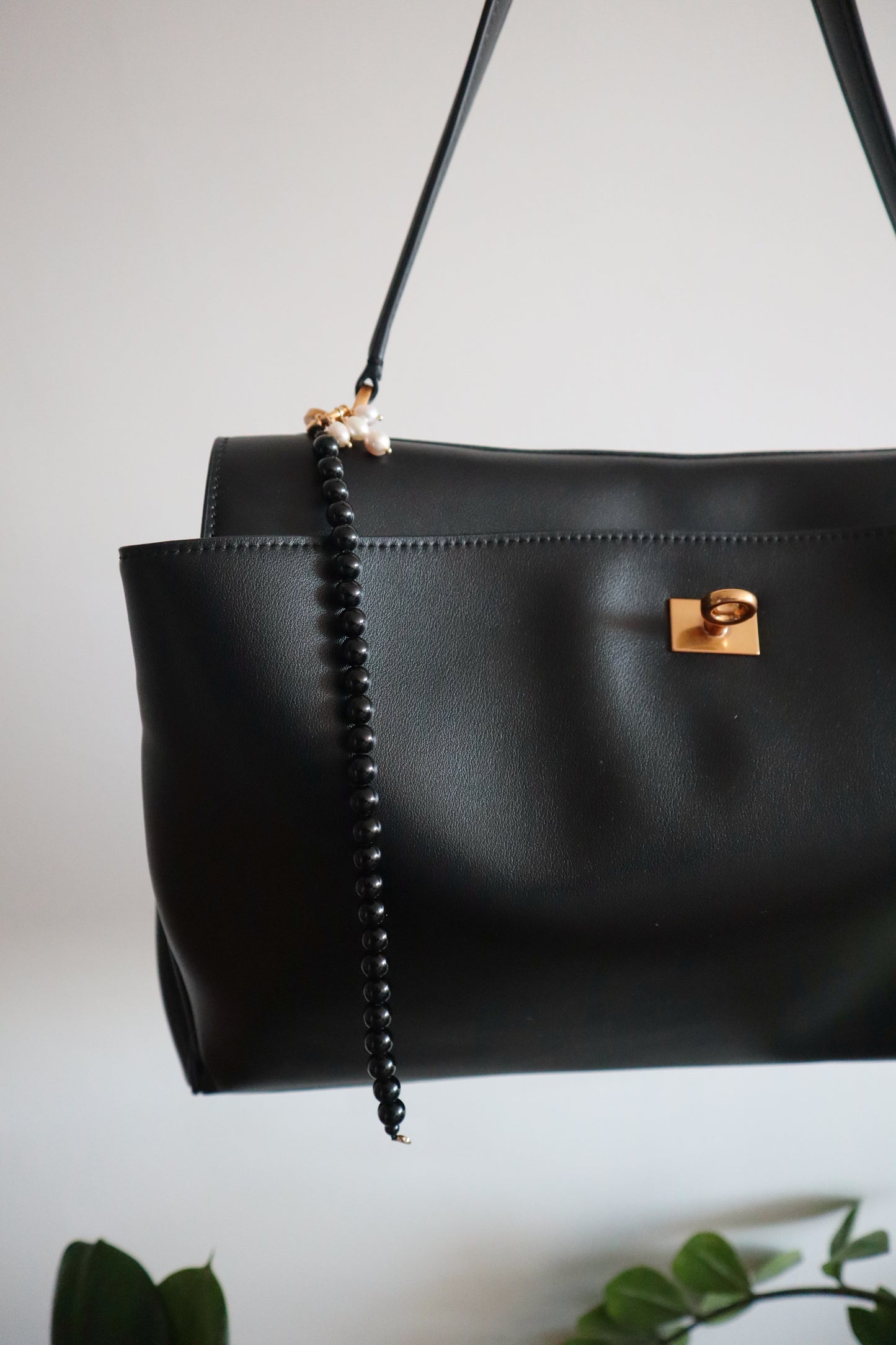 Black bag charm