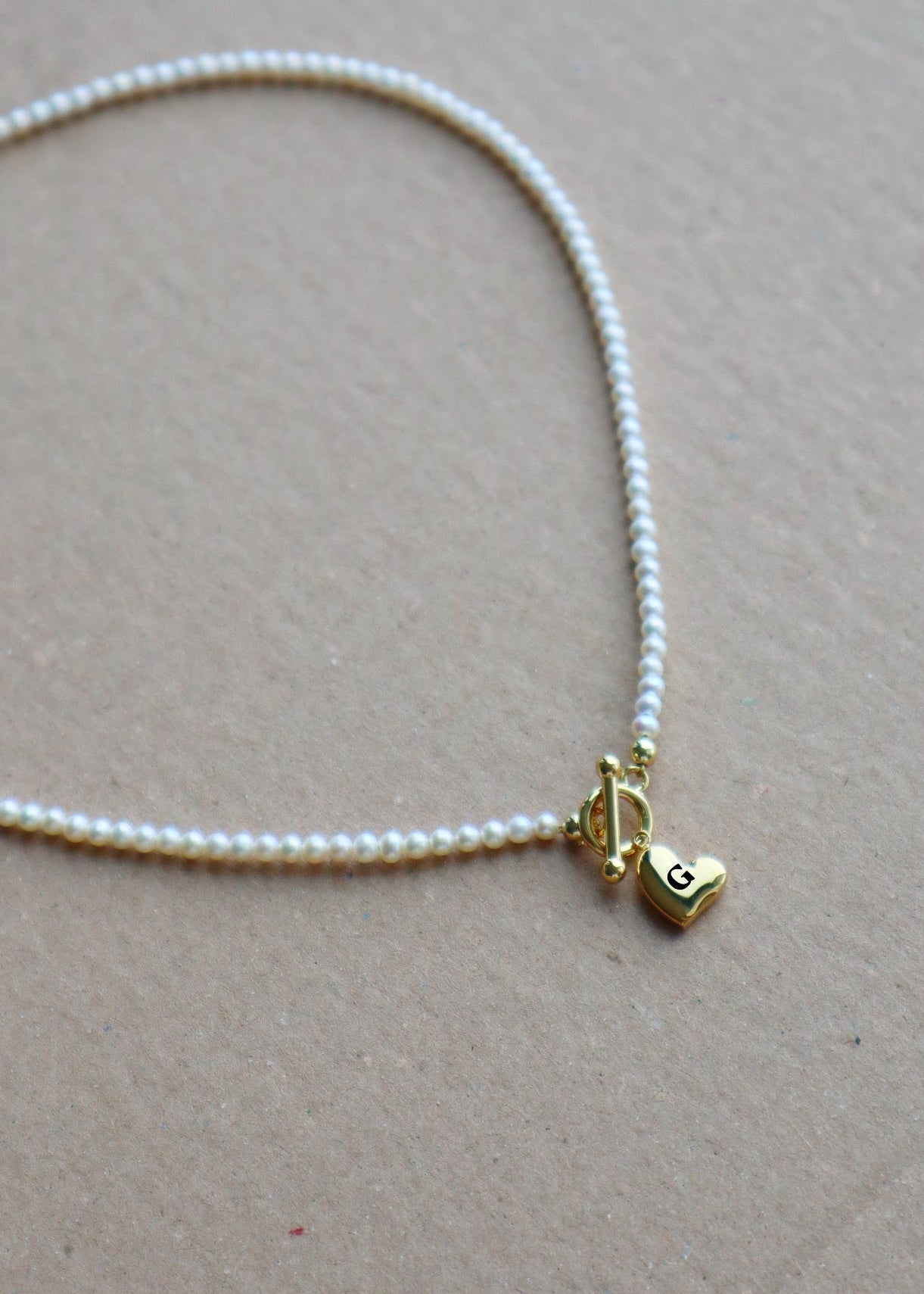 Pearl necklace with engravable heart pendant