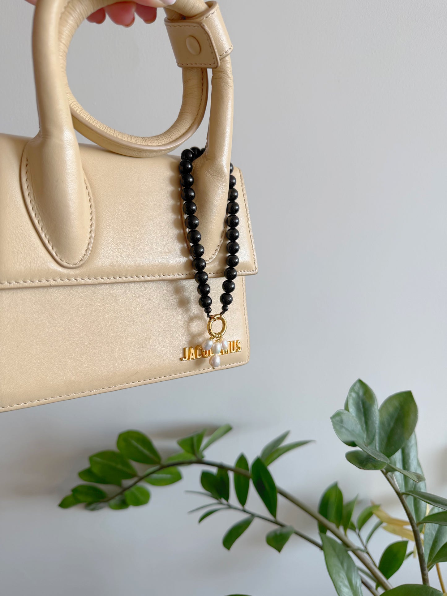 Black bag charm