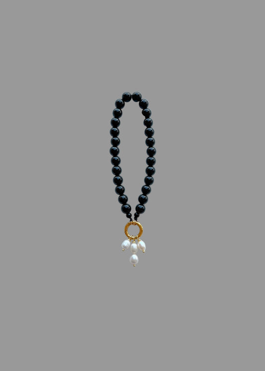 Black bag charm