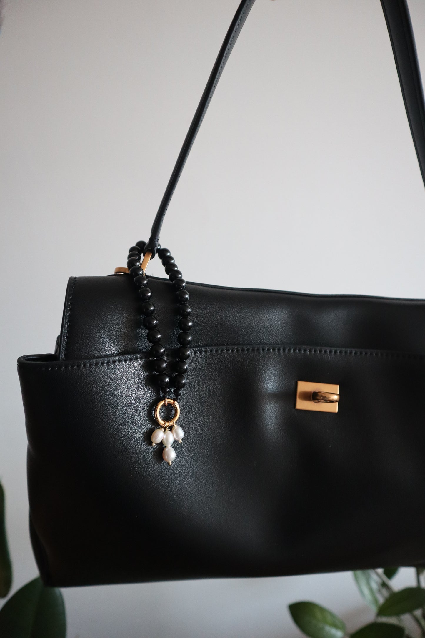 Black bag charm